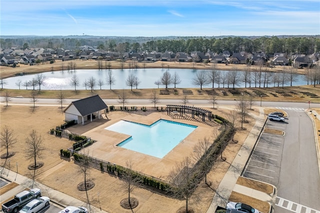 view of pool with a water view