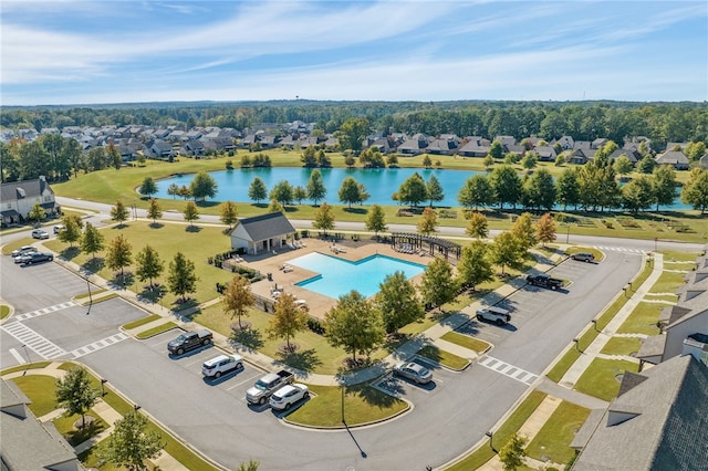 birds eye view of property with a water view