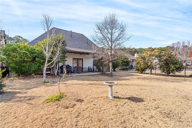 rear view of house with a patio