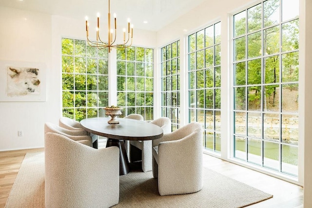 sunroom with a notable chandelier