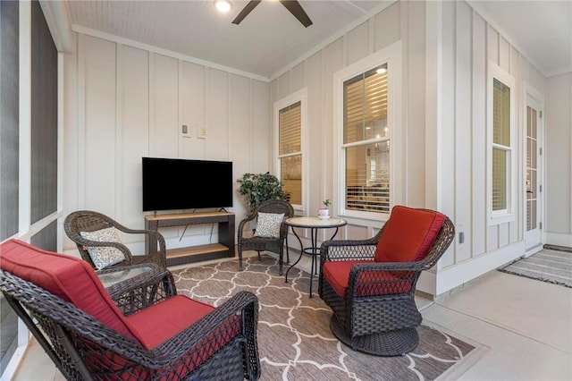 sunroom featuring ceiling fan