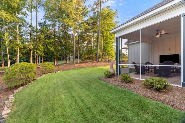 view of yard featuring a patio area and ceiling fan