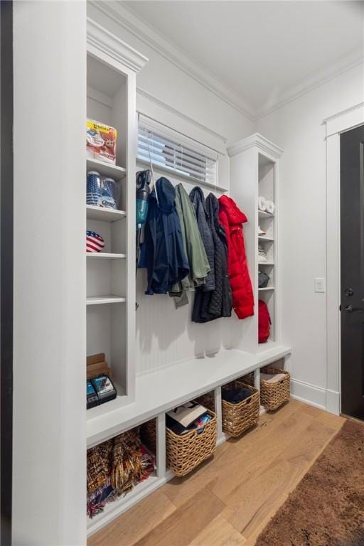 mudroom featuring hardwood / wood-style floors and crown molding
