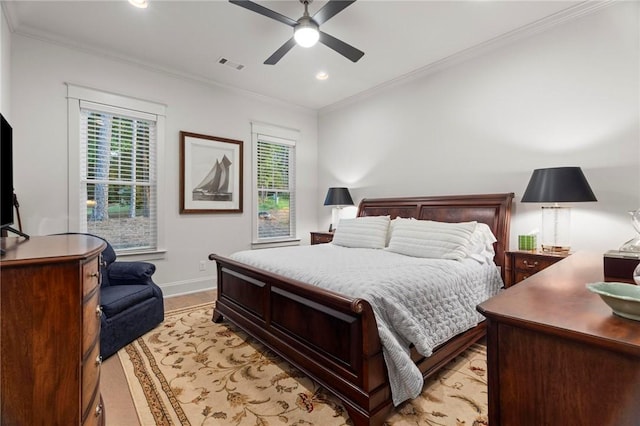 bedroom featuring ceiling fan and ornamental molding