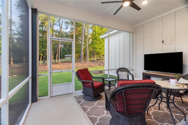 sunroom with ceiling fan and a healthy amount of sunlight