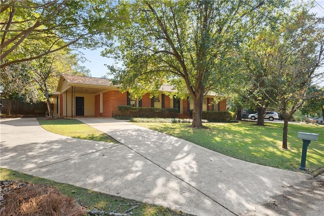 view of front of house featuring a front yard and a carport