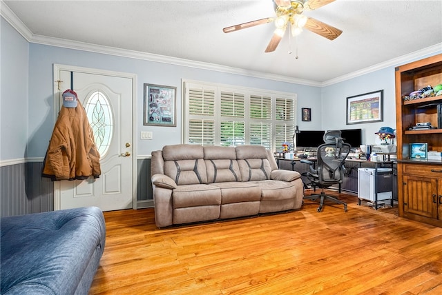 3509 Saugahatchee Lake Rd, Opelika, AL 36801 - living area with light wood-style floors, crown molding, a wainscoted wall, and a ceiling fan