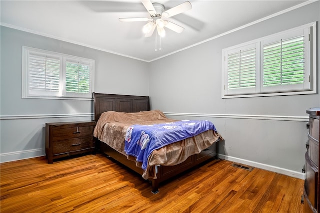 3509 Saugahatchee Lake Rd, Opelika, AL 36801 - bedroom with baseboards, visible vents, ornamental molding, and wood finished floors