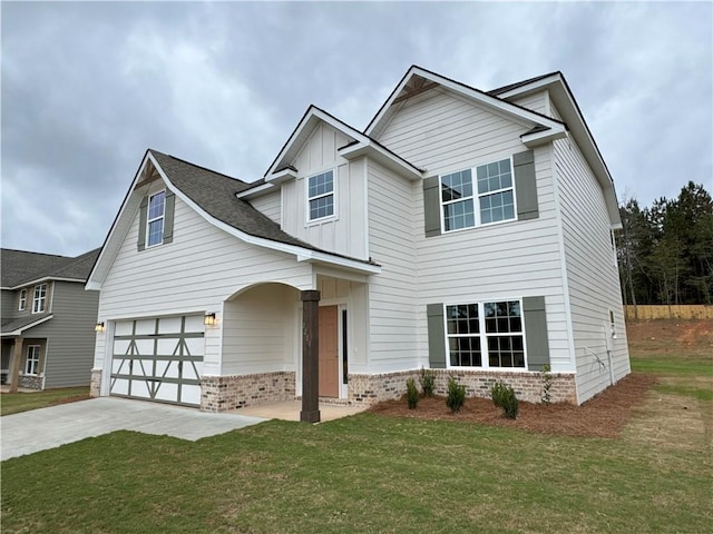 craftsman-style home featuring a front yard and a garage