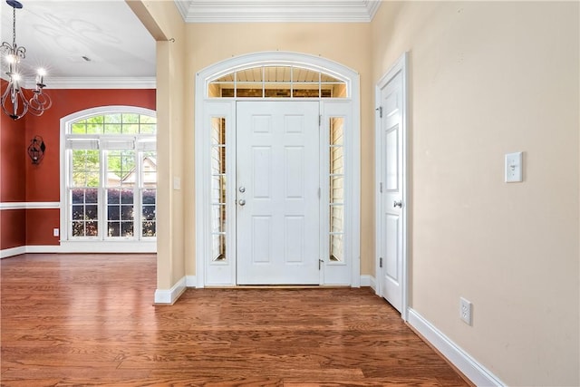 1817 Roanoke Ln, Auburn, AL 36830 - foyer entrance with a chandelier, wood finished floors, and ornamental molding