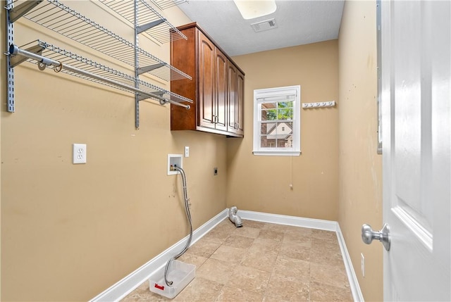 1817 Roanoke Ln, Auburn, AL 36830 - laundry area featuring cabinet space, hookup for an electric dryer, and hookup for a washing machine