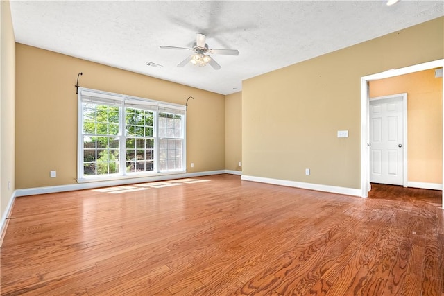 1817 Roanoke Ln, Auburn, AL 36830 - unfurnished room featuring a ceiling fan, wood finished floors, and a textured ceiling