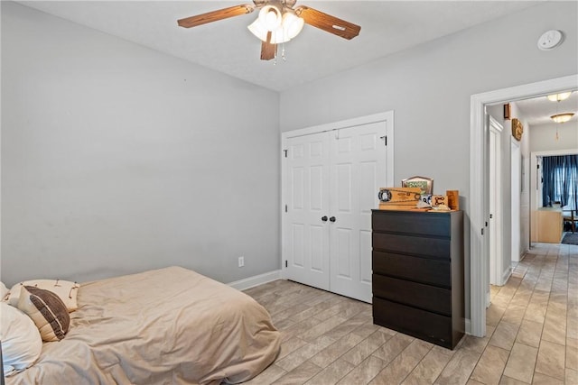 1630 Academy Dr Unit 402, Auburn, AL 36830 - bedroom with attic access, a closet, a ceiling fan, and light wood-type flooring