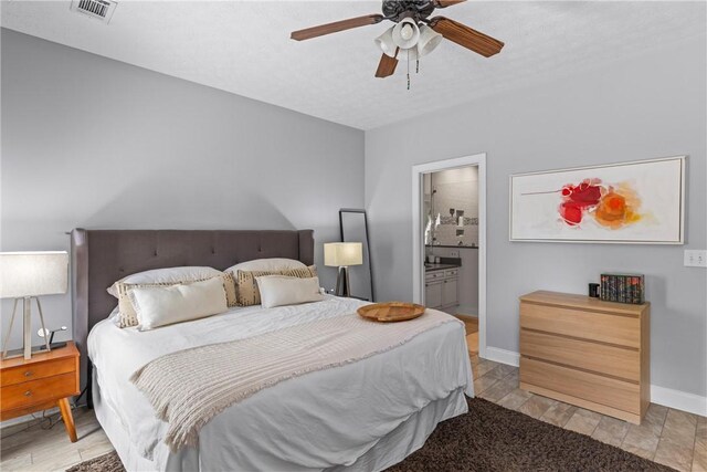 1630 Academy Dr Unit 402, Auburn, AL 36830 - bedroom featuring ensuite bath and a ceiling fan