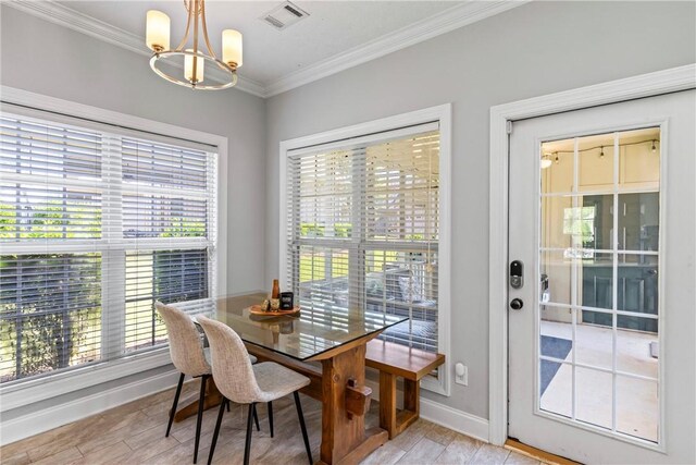 1630 Academy Dr Unit 402, Auburn, AL 36830 - dining room with a chandelier, healthy amount of natural light, crown molding, and light wood finished floors