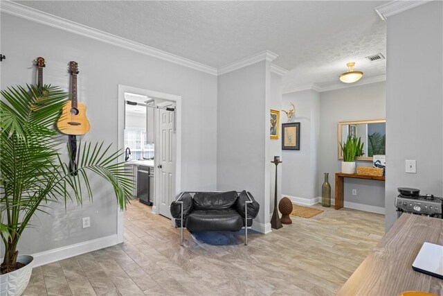 1630 Academy Dr Unit 402, Auburn, AL 36830 - living area with crown molding, a textured ceiling, and light wood-style floors