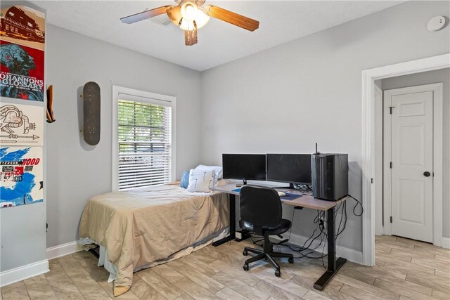 1630 Academy Dr Unit 402, Auburn, AL 36830 - bedroom featuring light wood finished floors, ceiling fan, and a desk