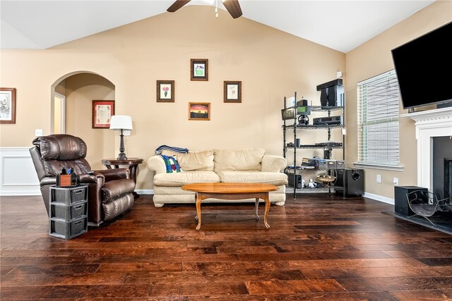 704 Lori Ln, Opelika, AL 36804 - living area with wood-type flooring, a ceiling fan, arched walkways, and lofted ceiling