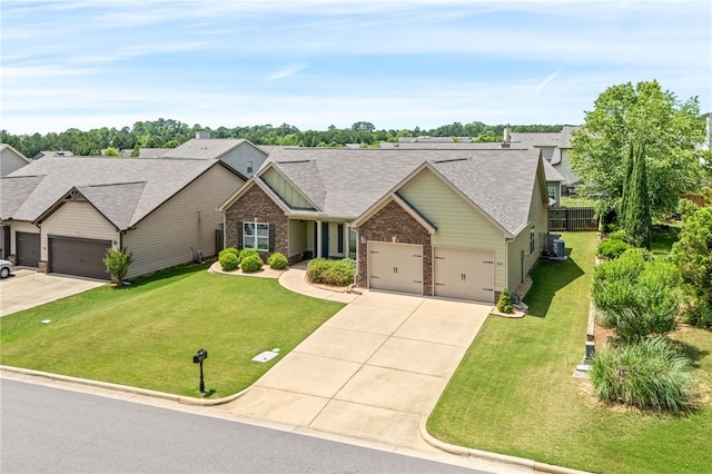704 Lori Ln, Opelika, AL 36804 - view of front of property featuring concrete driveway, a garage, a front lawn, and brick siding