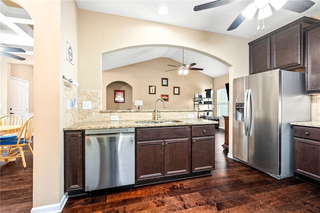 704 Lori Ln, Opelika, AL 36804 - kitchen featuring stainless steel appliances, a ceiling fan, a sink, dark wood-style flooring, and lofted ceiling
