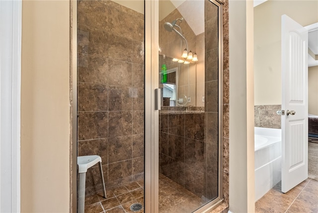 704 Lori Ln, Opelika, AL 36804 - full bath with a stall shower, a bath, and tile patterned flooring