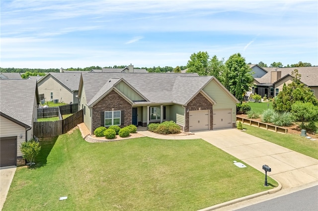 704 Lori Ln, Opelika, AL 36804 - view of front facade featuring concrete driveway, brick siding, an attached garage, a shingled roof, and board and batten siding