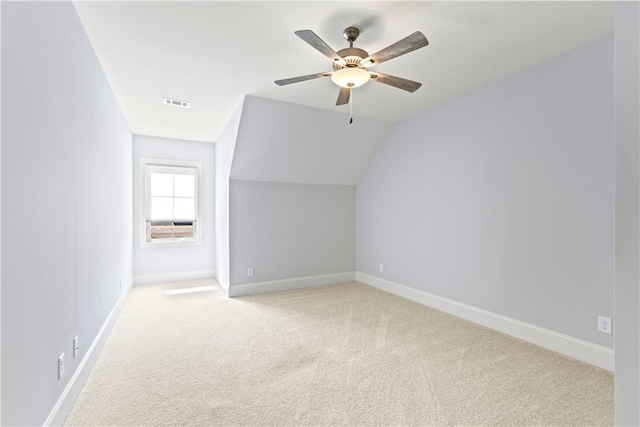 bonus room featuring vaulted ceiling, carpet floors, visible vents, and baseboards