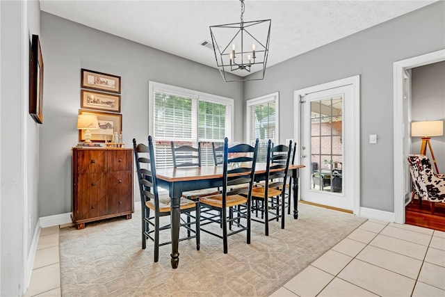 1939 Windway Rd, Auburn, AL 36830 - dining room with a chandelier, tile patterned floors, and baseboards