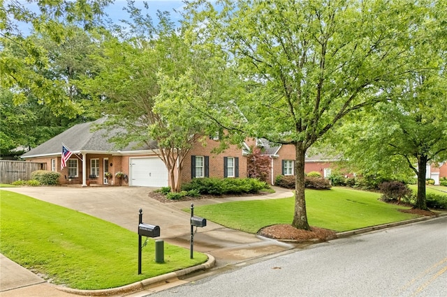1939 Windway Rd, Auburn, AL 36830 - view of front of house featuring an attached garage, concrete driveway, and brick siding