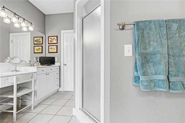 1939 Windway Rd, Auburn, AL 36830 - full bath featuring a stall shower, vanity, and tile patterned flooring