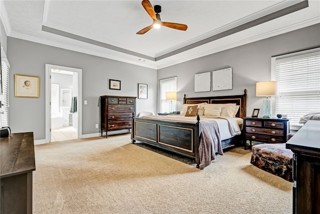 1939 Windway Rd, Auburn, AL 36830 - bedroom featuring light colored carpet, a tray ceiling, crown molding, ensuite bath, and baseboards