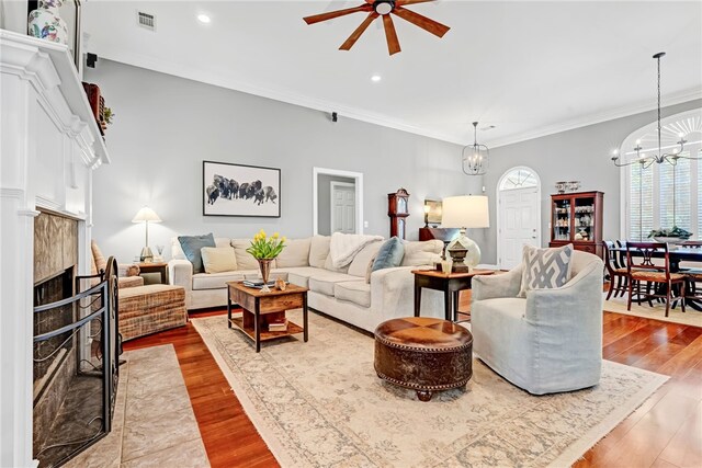 1939 Windway Rd, Auburn, AL 36830 - living area with a chandelier, ceiling fan, a high end fireplace, recessed lighting, and wood finished floors
