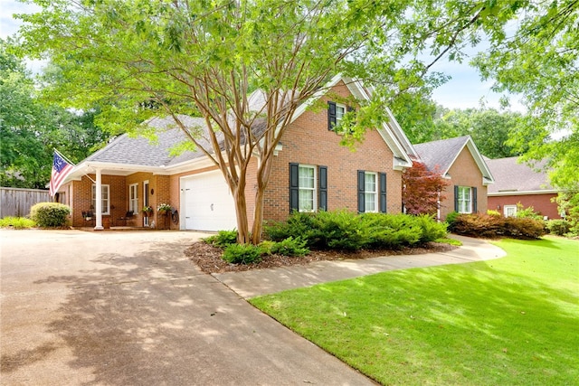 1939 Windway Rd, Auburn, AL 36830 - traditional home with brick siding, an attached garage, and driveway