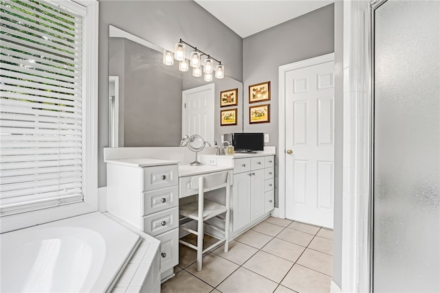 1939 Windway Rd, Auburn, AL 36830 - bathroom with vanity, tile patterned floors, a bath, and a shower stall