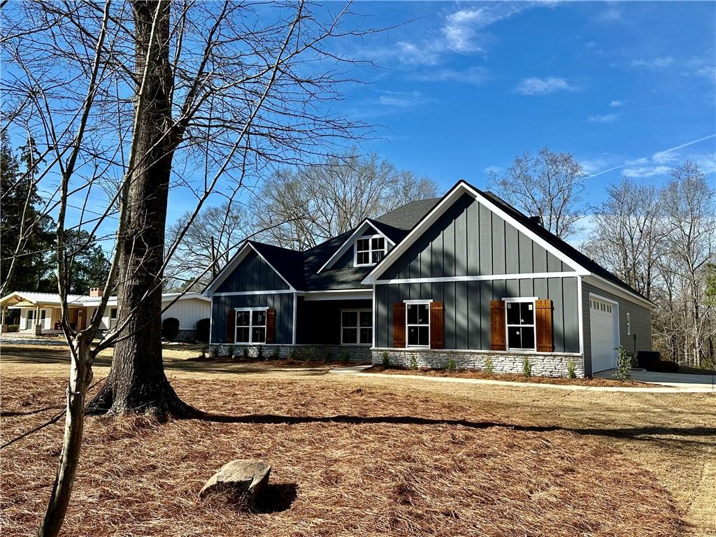 view of front of property featuring a garage and board and batten siding