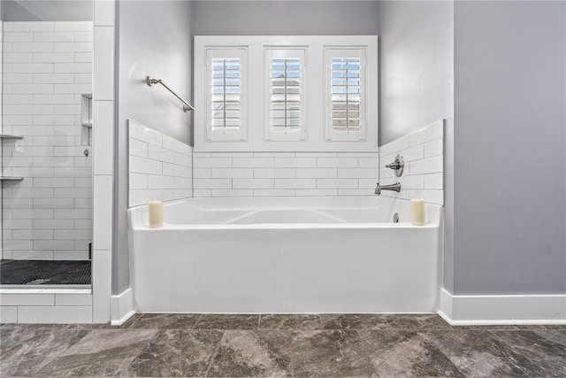 bathroom with separate shower and tub