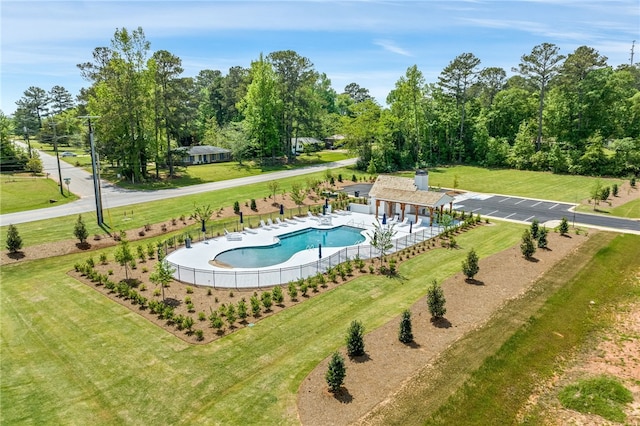 view of swimming pool with a patio and a lawn
