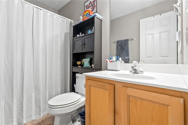 bathroom with tile patterned floors, vanity, and toilet