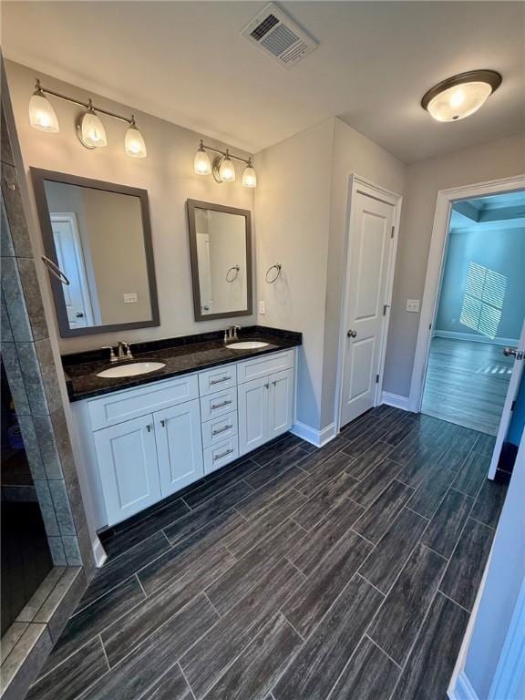 bathroom featuring vanity and walk in shower