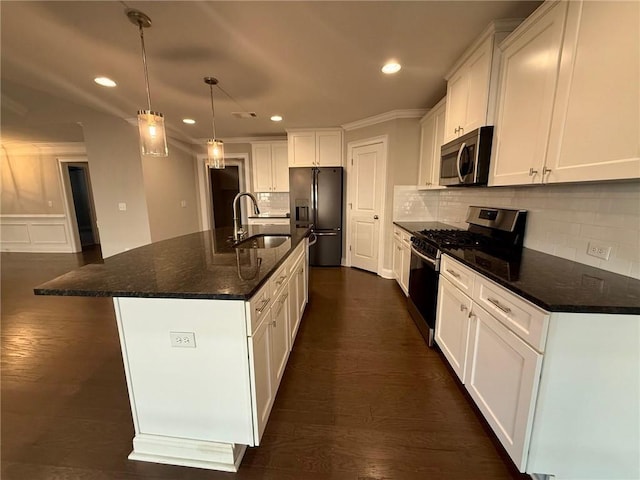 kitchen featuring white cabinets, a center island with sink, black range with gas stovetop, sink, and refrigerator with ice dispenser