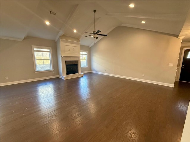 unfurnished living room with ceiling fan, dark hardwood / wood-style floors, and vaulted ceiling