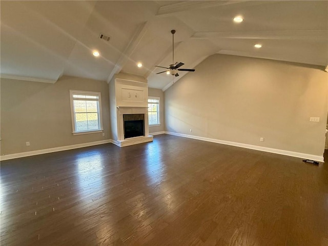 unfurnished living room with lofted ceiling with beams, ceiling fan, and dark wood-type flooring