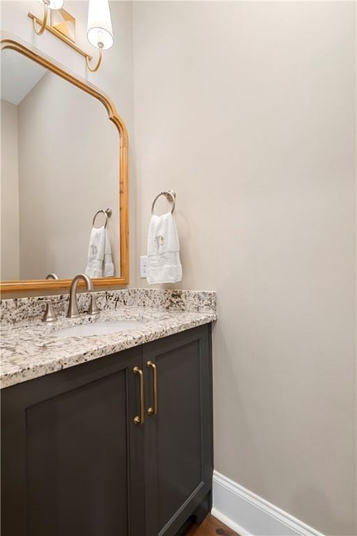 bathroom featuring vanity and baseboards