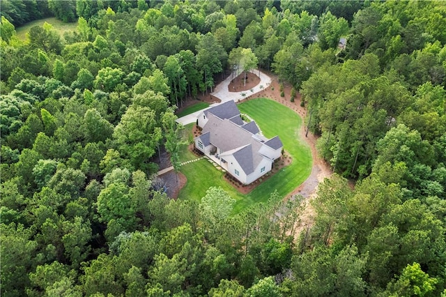 bird's eye view featuring a wooded view