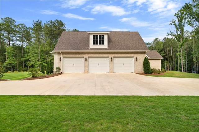 exterior space with a garage and a lawn