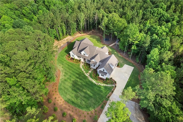 bird's eye view featuring a wooded view