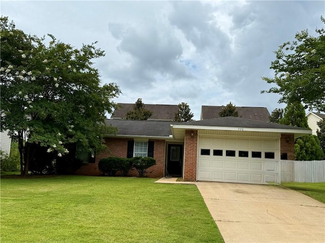770 Whitaker Ln, Auburn, AL 36830 - ranch-style house featuring brick siding, driveway, a garage, and a front lawn