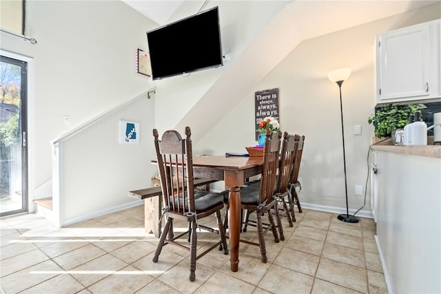 dining area with light tile patterned floors