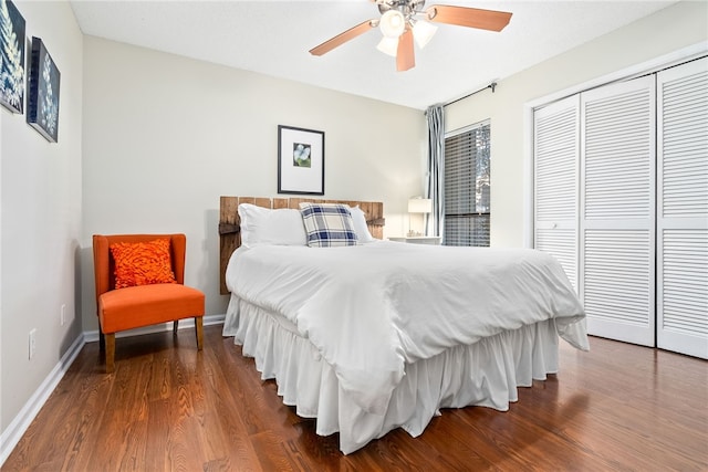 bedroom with hardwood / wood-style floors, a closet, and ceiling fan