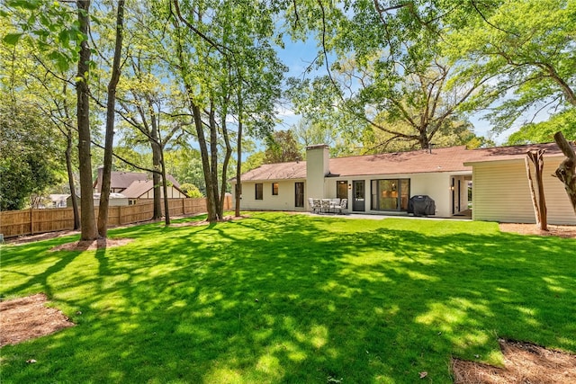 322 Cricket Ln, Auburn, AL 36832 - back of house featuring a chimney and a patio area